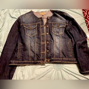 Super cute jean jacket. Dark in color.